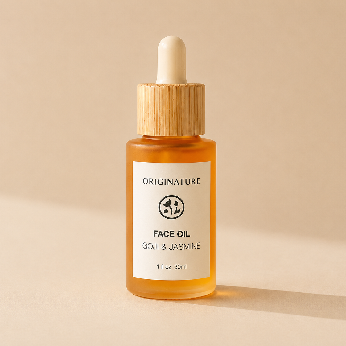 Originature face oil bottle with dropper on a beige background